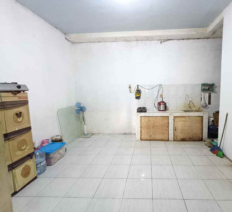 over kredit rumah taman mutiara indah 2