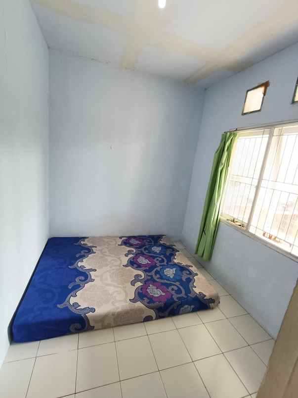 over kredit rumah taman mutiara indah 2