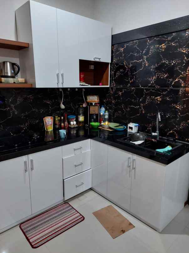 dijual rumah cluster bali garden city