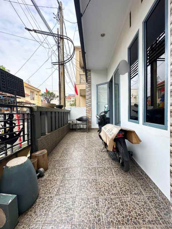 rumah 2nd 2lt plus rooftop di cikunir bekasi selatan