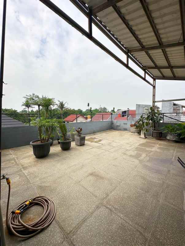 rumah 2nd 2lt plus rooftop di cikunir bekasi selatan