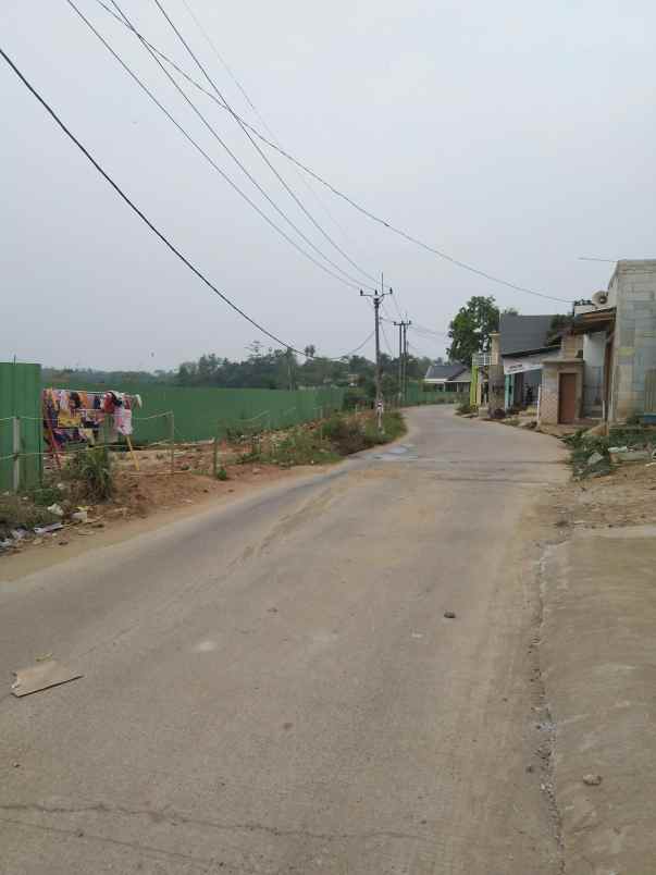 tanah strategis pinggir jalan depan komplek perumahan