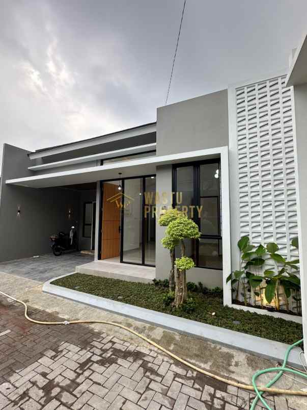 rumah modern dalam cluster di mlati sleman