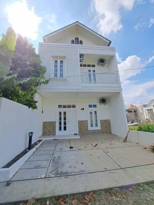 ahzavi rumah 2 lantai dekat gt jatiwarna