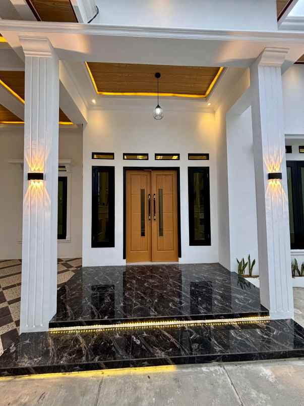 dijual rumah perumahan taman raya