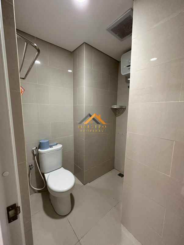 dijual apartemen podomoro city deli tower